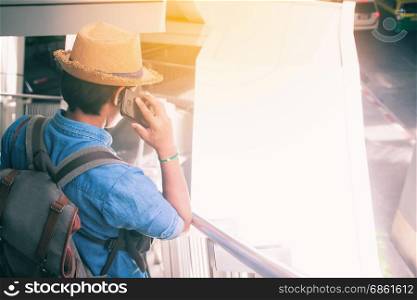 Young asian tourist man using smartphone, Travel and Lifestyle concept