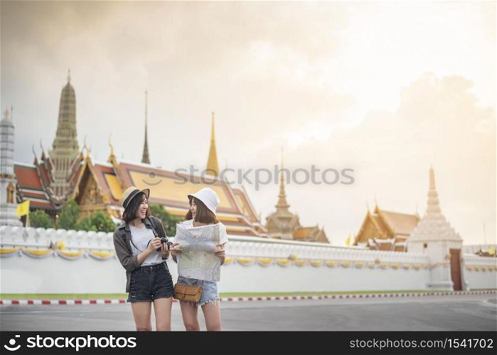 Young Asian travel girls are enjoying with beautiful place in Bangkok, Thailand