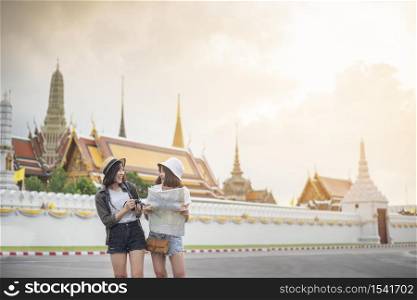 Young Asian travel girls are enjoying with beautiful place in Bangkok, Thailand