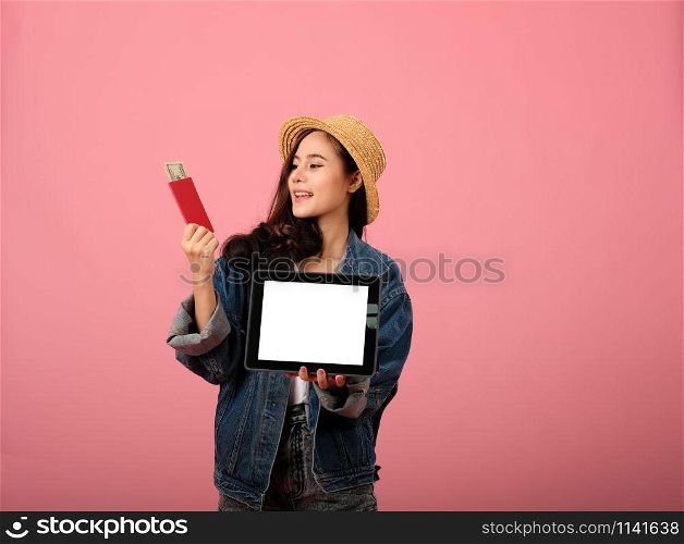 young asian woman backpacker traveler with tablet passport money. journey trip travel. studio shot