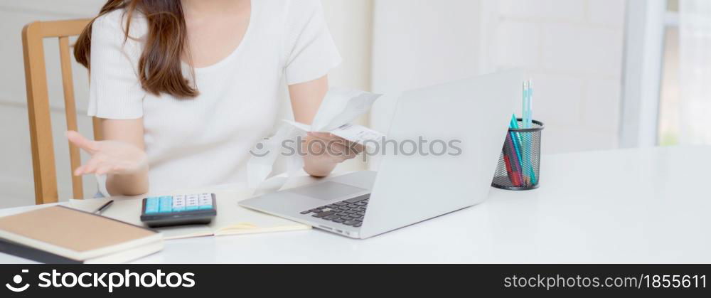 Young asian woman calculating expenses household about finance and frustrated on desk at home, girl checking bill having stress and worried, debt and tax, expression and emotion, business concept.