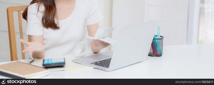 Young asian woman calculating expenses household about finance and frustrated on desk at home, girl checking bill having stress and worried, debt and tax, expression and emotion, business concept.