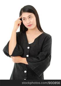 Young Asian woman dressed casual black clothes keeping forefinger on temple and looking aside while having thoughtful expression isolated on white background