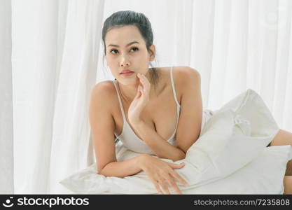 Young asian woman feeling depress stress. She stay isolation at home for self quarantine. Corona virus outbreak situation. Self quarantine at home prevention COVID-19.