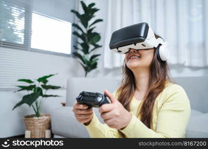 Young Asian woman gamer wearing virtual reality touching air during the VR experience  Future home technology player hobby playful enjoyment concept