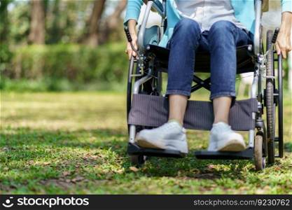 Young asian woman in wheelchair with positive thinking