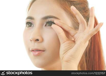 Young asian woman makeup false eyelash isolated on white background