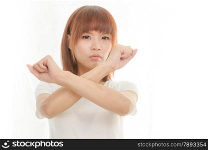 Young Asian woman making stop gesture over white background