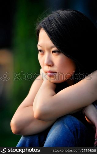 Young asian woman portrait. Young asian woman portrait, natural blurred background