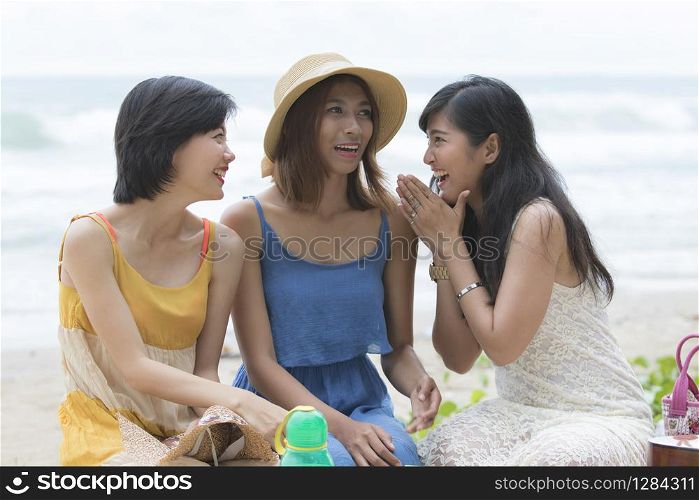 young asian woman relaxing happiness traveling time at sea beach