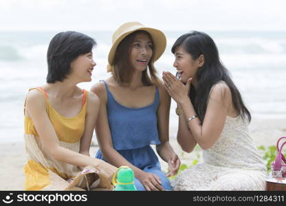 young asian woman relaxing happiness traveling time at sea beach