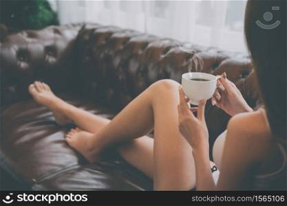 Young asian woman relaxing on the sofa at home.