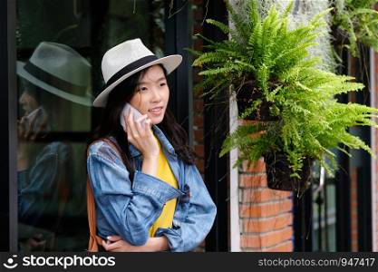 Young asian woman taking phone in city outdoors background, people on phone in urban lifestyles