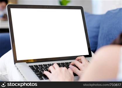 Young asian woman using laptop computer with blank screen for mock up template background, technology and lifestyle, working at home background concept