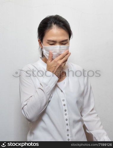 Young Asian woman wearing surgical mask prevent germs, toxic fumes,dust isolated on white background,Wuhan coronavirus (COVID-19) outbreak prevention in public area. Health care and medical concept.