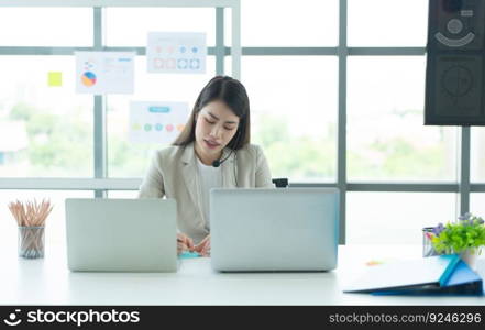 Young asian woman working at a call center Consulting about stock investment information with customers calling for advice with emotion of serious and concern