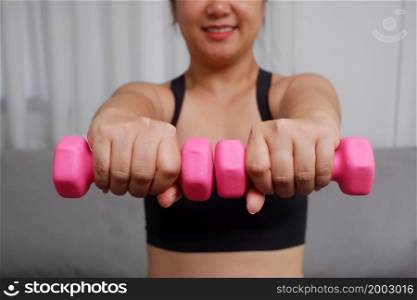 Young asian women doing exercise at home