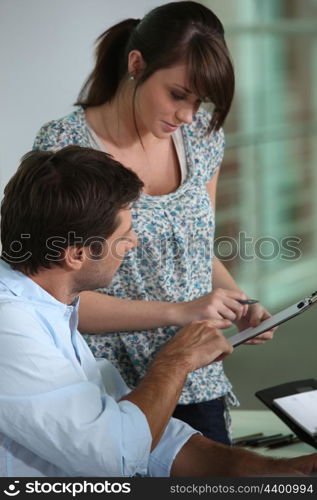 Young assistant with a colleague