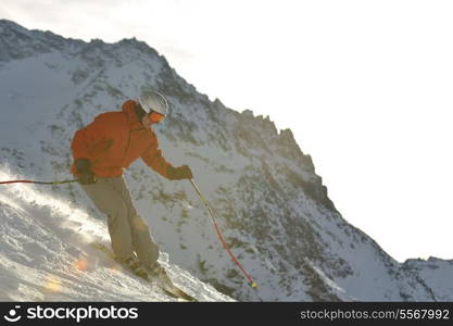 young athlete man have fun during skiing sport on hi mountain slopes at winter seasson and sunny day