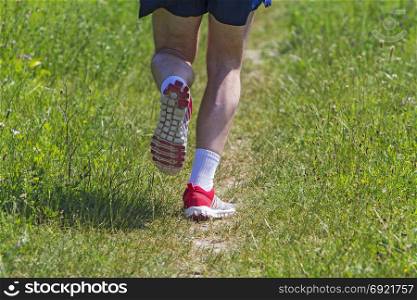 Young athlete running marathon outdoors