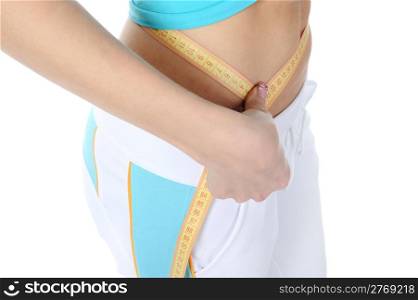 Young athletic woman measuring waist. Isolated on white background