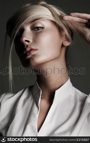 Young attractive blond female with creativity hairstyle