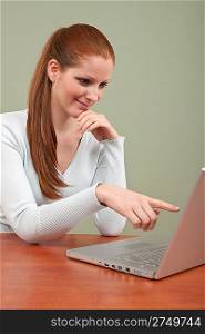 Young attractive business woman working at office with laptop