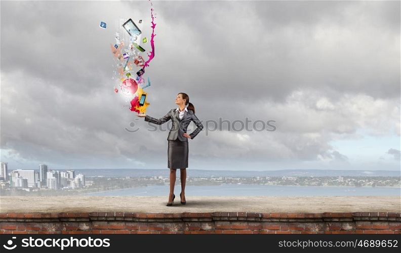 Young attractive businesswoman and color icon in her palm. More color and creativity