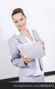 Young attractive businesswoman at meeting with documents in hands. I have some fresh ideas