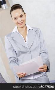 Young attractive businesswoman at meeting with documents in hands. I have some fresh ideas