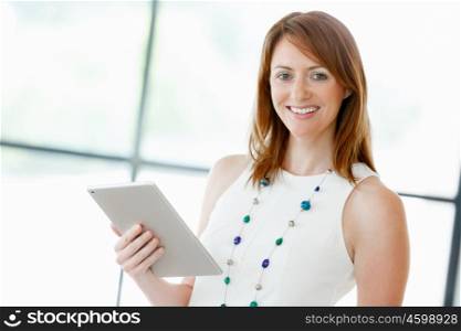 Young attractive businesswoman in office