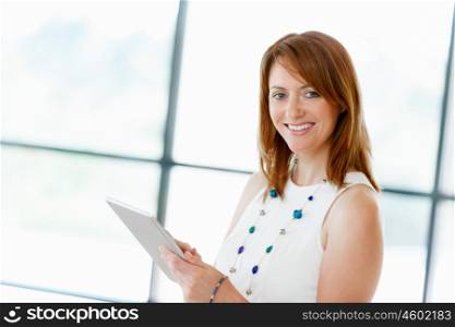 Young attractive businesswoman in office