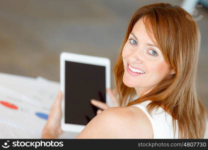 Young attractive businesswoman in office