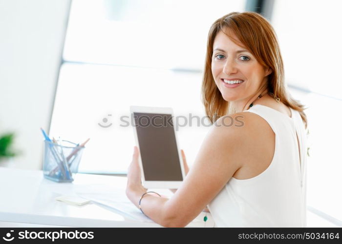 Young attractive businesswoman in office