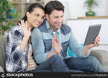 young attractive couple having online video chat