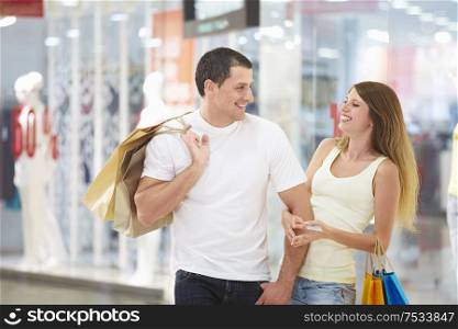 Young attractive couple in shop