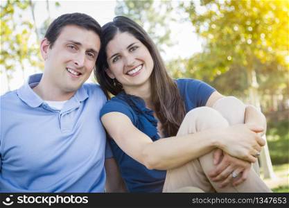 Young Attractive Couple Intimate Portrait Outdoors in the Park.