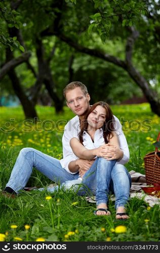 Young attractive couple on rest in park