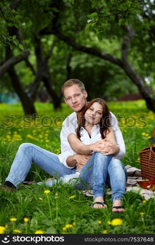 Young attractive couple on rest in park