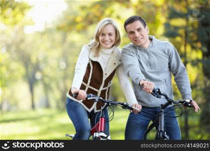 Young attractive couple with bicycles