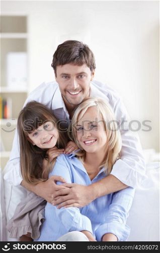 Young attractive family home on the couch