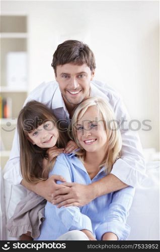 Young attractive family home on the couch