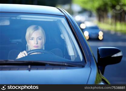 Young attractive girl behind the wheel