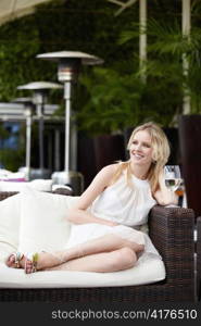 Young attractive girl in a dress in a restaurant