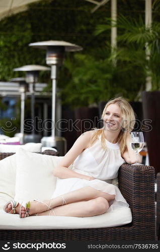 Young attractive girl in a dress in a restaurant