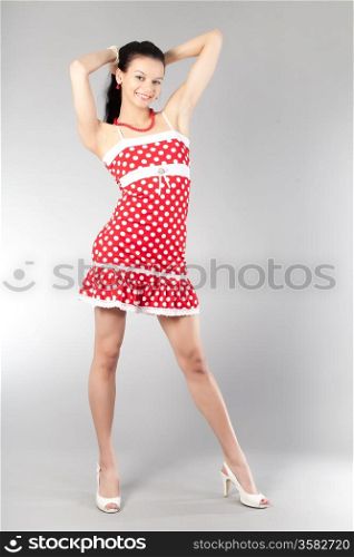 Young attractive girl in red dress