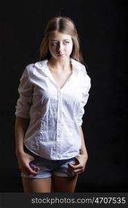 Young attractive girl in white shirt, studio isolated shot