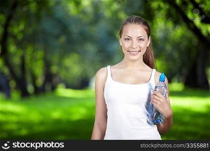 Young attractive girl with a bottle of water