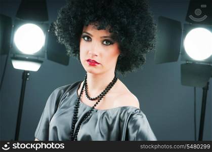 Young attractive girl with afro curly haircut