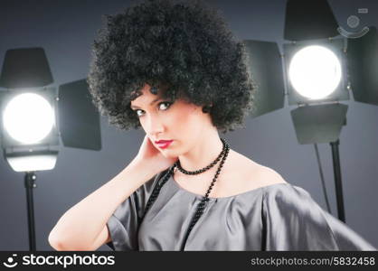 Young attractive girl with afro curly haircut